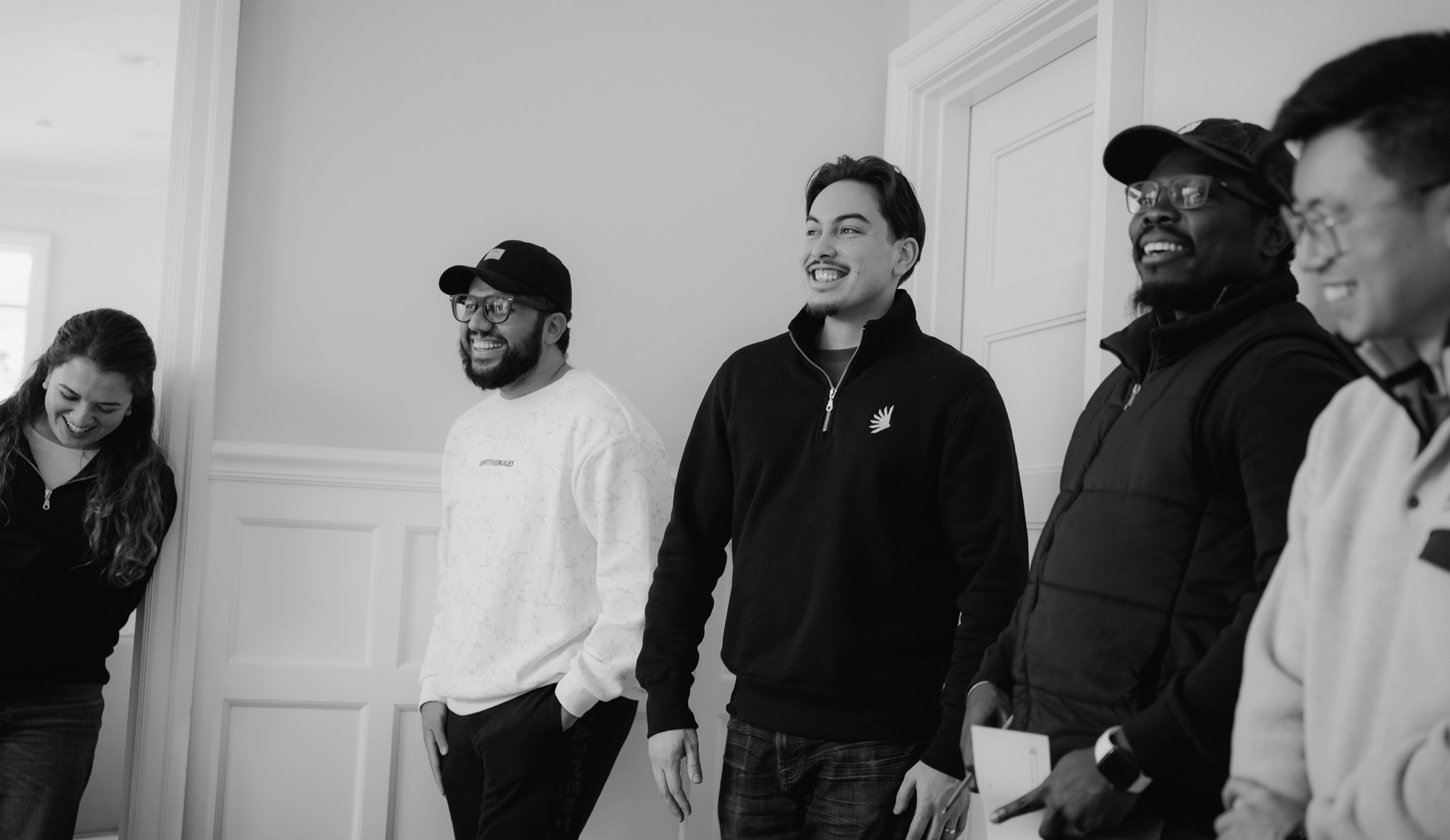 Minerva team members laughing in a candid photograph